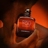 Front packshot of Emporio Armani Stronger With You Absolutely Parfum for Men in a rounded square clear glass bottle with amber fragrance and a glossy dark metallic cap