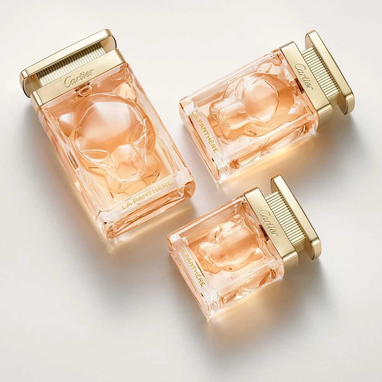 Three sizes of La Panthère Eau de Parfum - Sensual Floral Chypre Perfume displayed together, emphasizing product variety and luxury packaging.