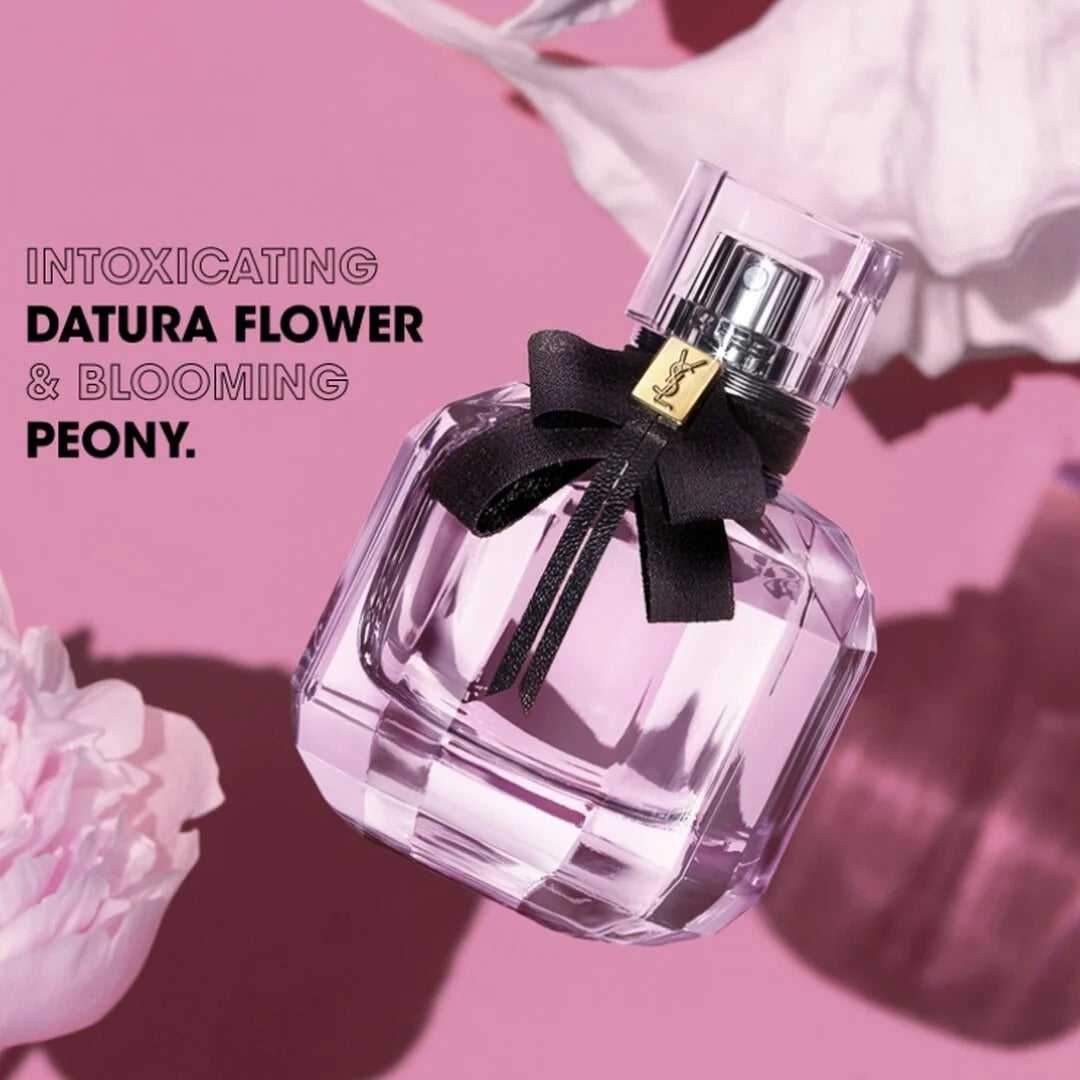 YSL Mon Paris Eau de Parfum 90ml showcased on pink background with text highlighting Datura flower and blooming peony floral notes.